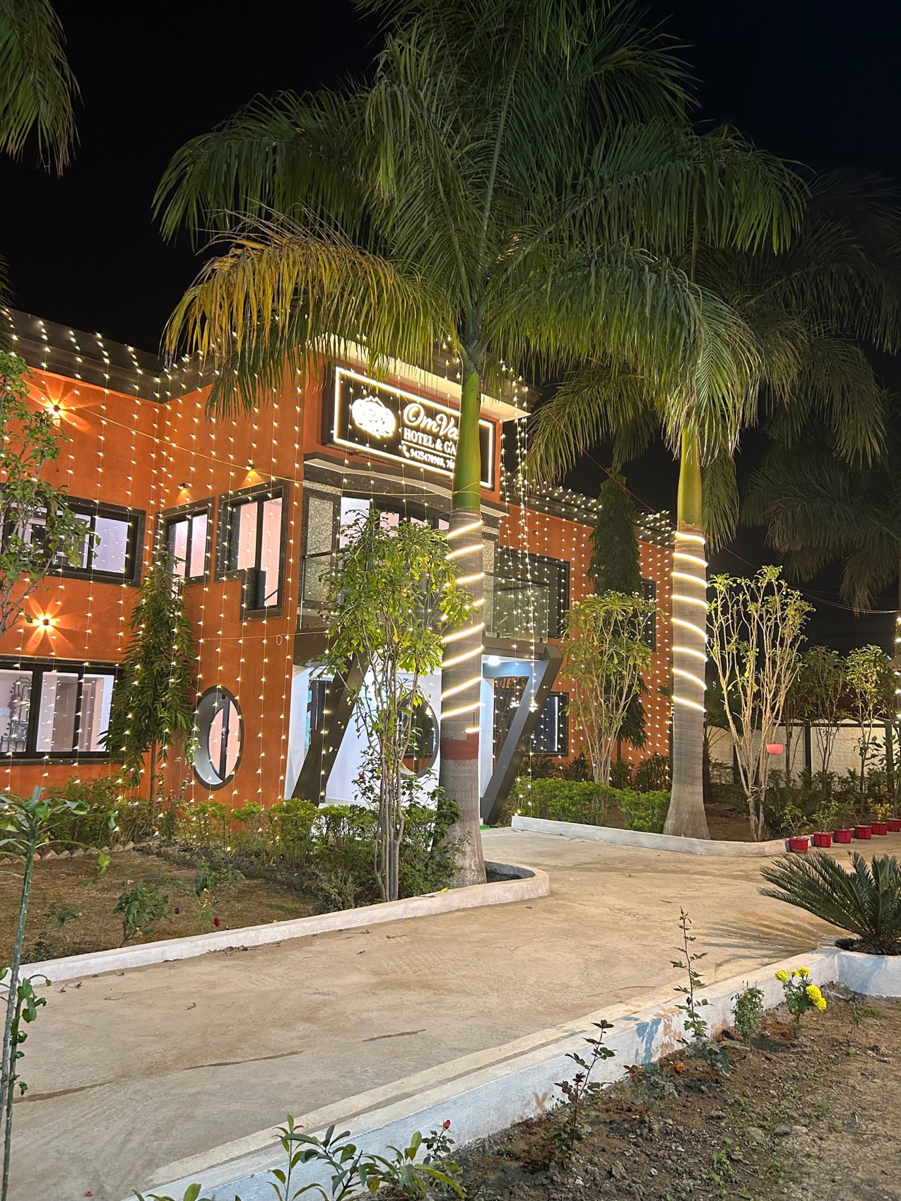 OmVana Hotel & Garden, Maihar — front of the hotel in the evening